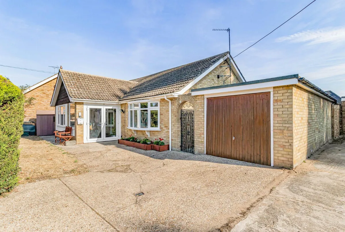 A detached brick bungalow with a garage and a glazed porch on Boundary Road, Red Lodge