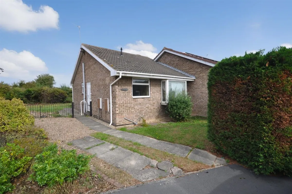 A brick semi-detached bungalow with a bay window and a front lawn on Grampian Way, Thorne