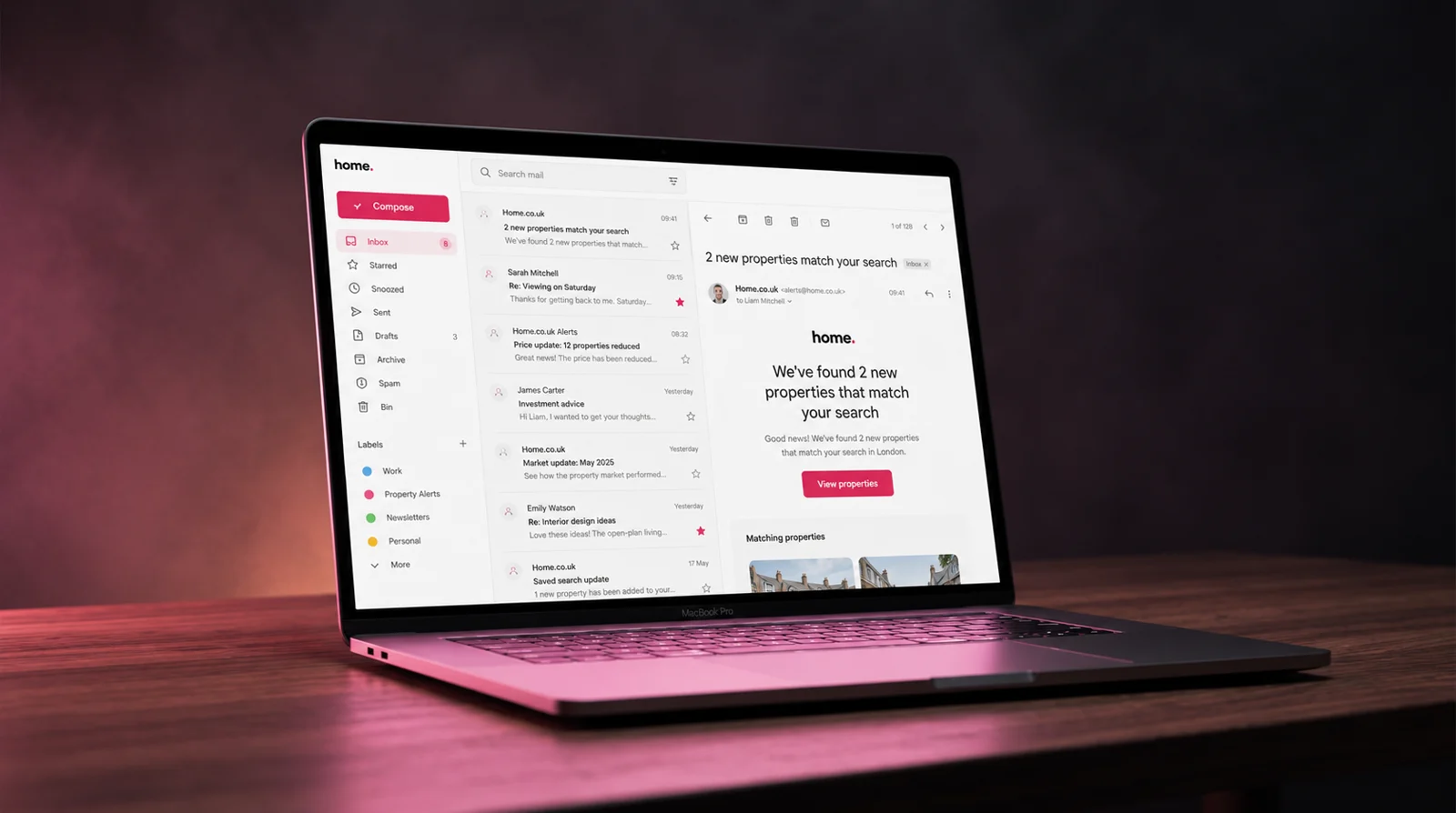 The real Mail client in the surveyor dashboard, shown on a MacBook — an inbox list of threads down one side and a reading pane alongside it